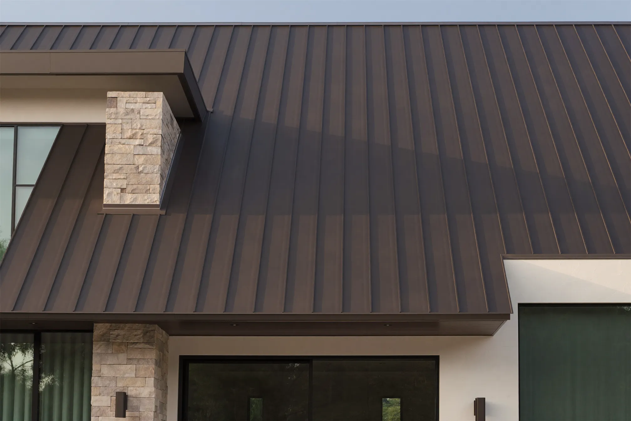 Dark bronze standing seam metal roof on a modern Southlake home